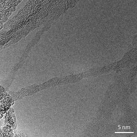 A transmission electron micrograph showing several ultrafine sodium titanate nanowires.