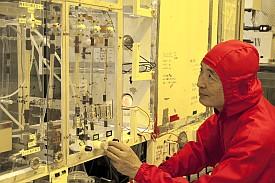 Esashi at his MEMS fabrication unit. His distinctive red cleansuit was given to him by his students to celebrate his  60th birthday.