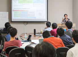 Uyen Tu Lieu giving a presentation. She is using computer simulations to explore the formation processes of soft materials.
